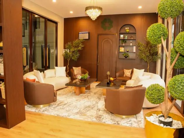 Lounge with cream sofas and topiary